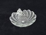 an image of a clear glass bowl with a flower on it