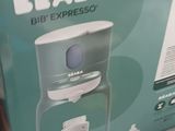 packaging of a coffee maker sitting on top of a table