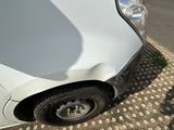a white car that is parked on the side of the road