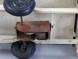 a small toy truck with a wheel on it ' s side