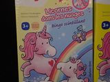 two boxes of children ' s books with unicorns and rainbows on them