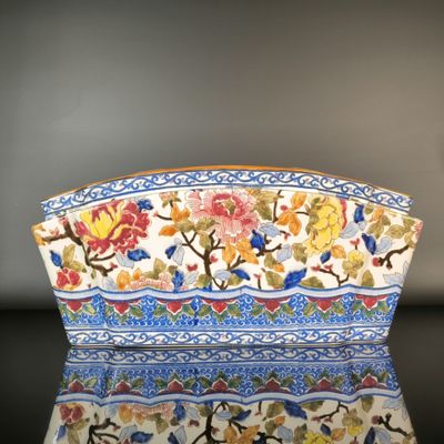 an image of a colorful flowered bowl on a table
