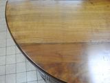 a wooden table with a clock on top of it