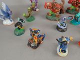many figurines of different types and sizes on the table