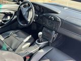a car dashboard with a steering wheel and a control panel
