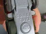 a person holding a toy car in their hand
