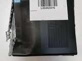 the back side of a laptop with a bar code on it