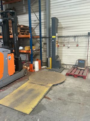 a forklift that is parked in a warehouse