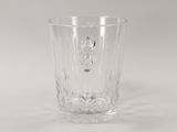 a clear glass with bubbles in it sitting on a table