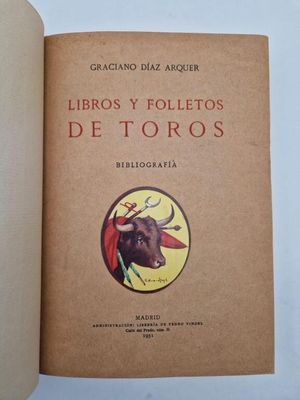 an open book with a picture of a bull on it