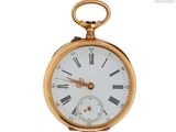 une montre de poche en or avec des chiffres romains sur le cadran