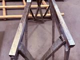 several pieces of wood sit on top of a table in a warehouse
