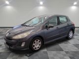 a picture of a gray car parked in a garage