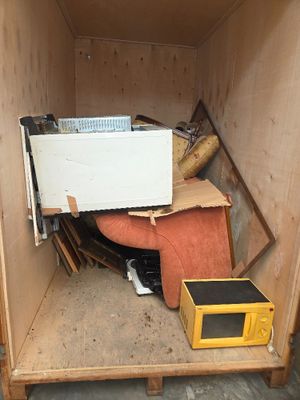 a box with a microwave inside of it and a box with a microwave inside of it