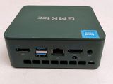 the back view of a small green device with two usb ports