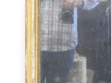 a man taking a picture of himself in a mirror