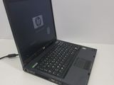 a laptop that is sitting on a white table