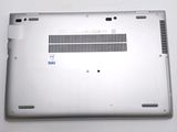 the back panel of a laptop with a small hole in it
