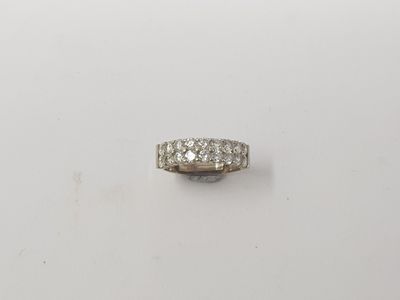 a white gold ring with three rows of diamonds