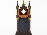 an image of a small wooden clock on a white surface