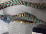 a close up of a pair of scissors and a rope