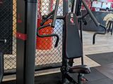 a gym room with a gym equipment set up on the floor