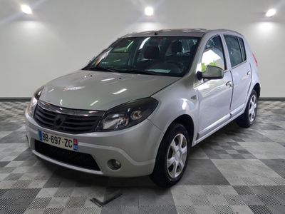 a picture of a small silver car parked in a garage