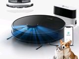 une image représentant un chien et un chat assis à côté d'un robot