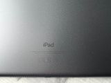 an apple ipad sitting on top of a marble counter top