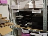 a room with a lot of boxes and boxes on the shelves