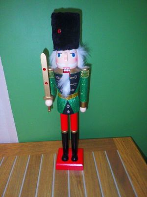 a toy soldier with a baseball bat on a table