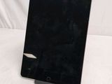 an image of a black tablet computer sitting on top of a table