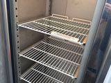 a refrigerator that has some shelves inside of it