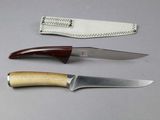 three different types of knives sitting on a table