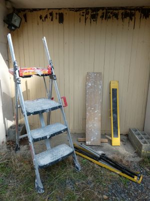 a ladder that is leaning against a building