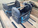 two luggage bags sitting on a pallet on a pallet