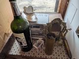 a bottle of wine sitting on a counter in a kitchen