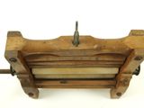 an old type of sewing machine on a white surface