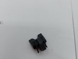 a small piece of black electrical wire on a piece of paper