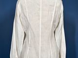 the back view of a white shirt on a mannequin mannequin stand