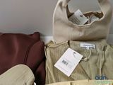 two bags and a handbag sitting next to each other