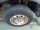 a flat tire on a flatbed truck on the road