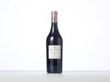 a bottle of wine that is sitting on a table