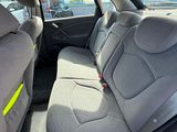 the back seats of a car with a yellow light in the back of it