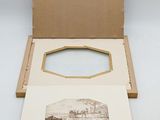 an open box with a picture inside of it sitting on a table