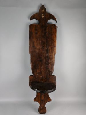 an old wooden chair sitting on top of a white floor