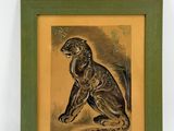 painting of a monkey in a green frame on a white wall
