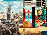 a large mural of a woman on the side of a building
