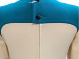 the back of a woman ' s jacket with a blue and white collar