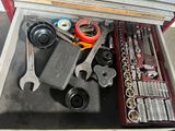a drawer full of tools that are sitting on a table